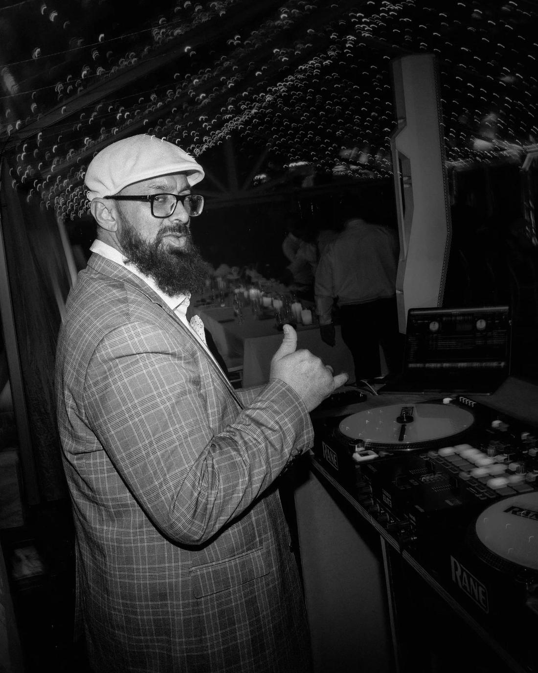Adam — ENVY Headliner DJ Host and co-founder, behind the decks