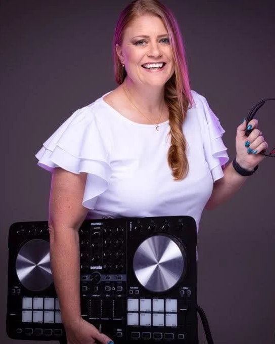 Claire - ENVY Boutique DJ, behind the decks