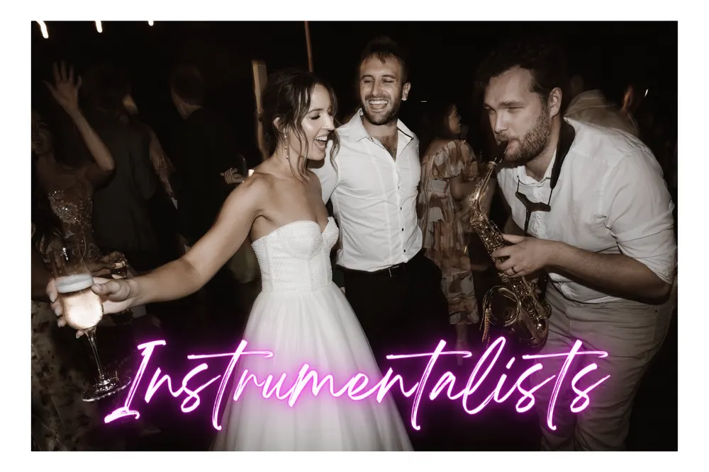 Saxophone instrumentalist playing beside a couple on the dance floor