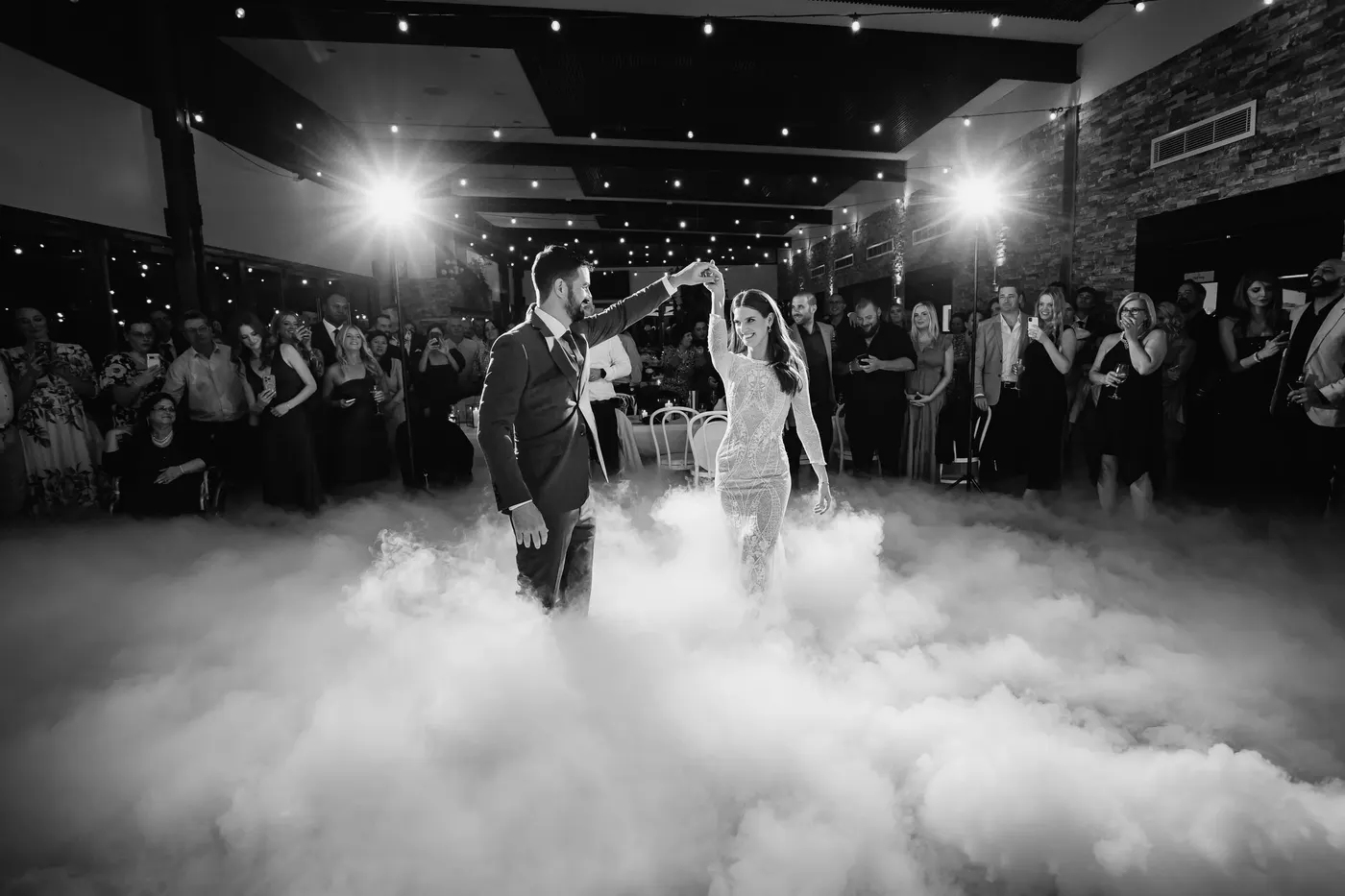 Couple's first dance surrounded by dancing on clouds effect