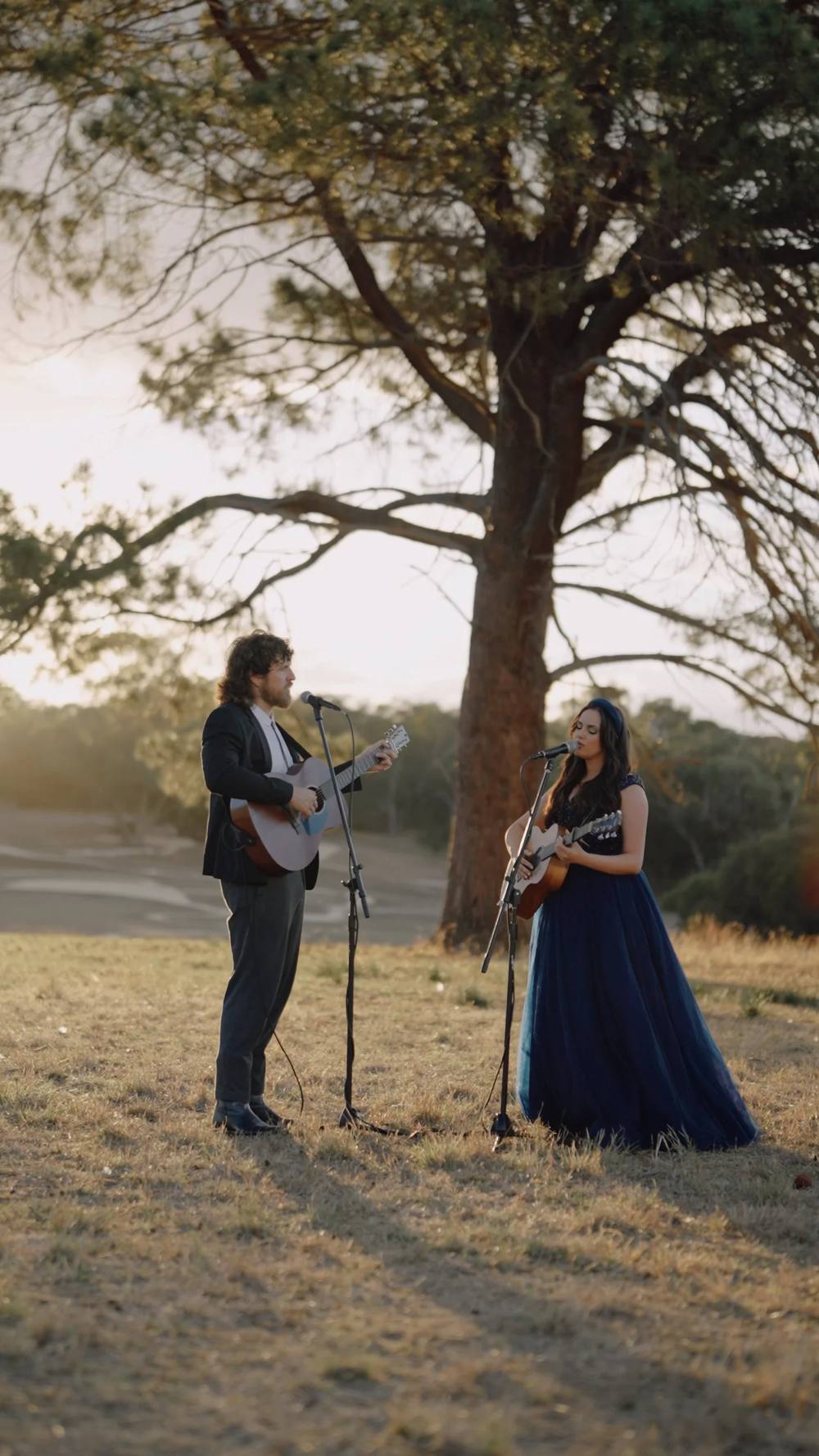 Johannah performing as a duo at golden hour