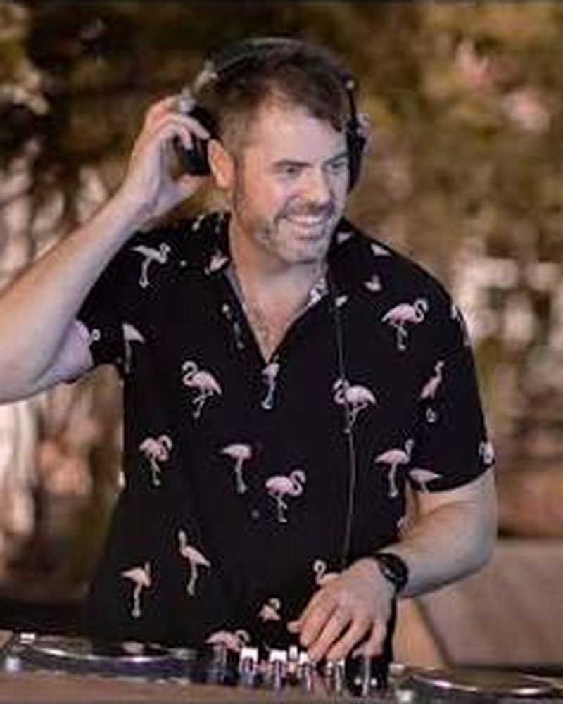 Jono - ENVY Boutique DJ Host, behind the decks