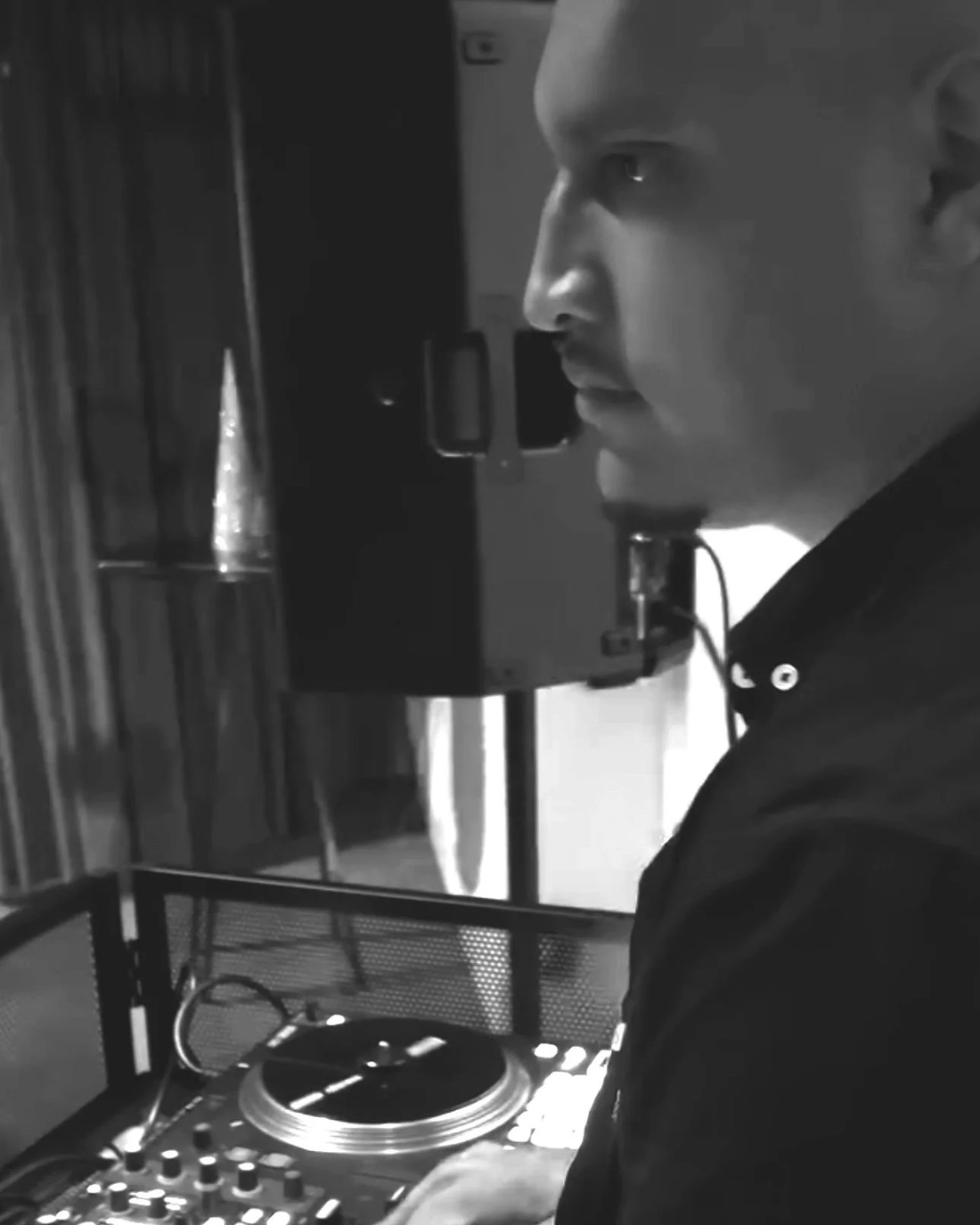 Manu - ENVY Boutique DJ, behind the decks